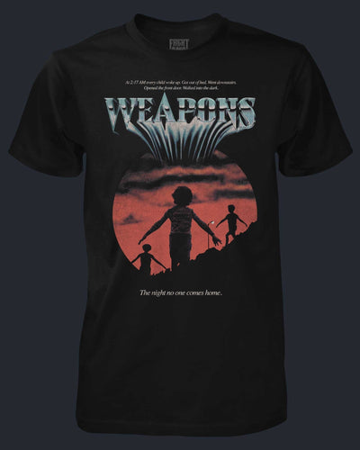 Black t-shirt with a graphic design of a silhouette of a woman and children against a sunset, with the word 'WEAPONS' at the top.
