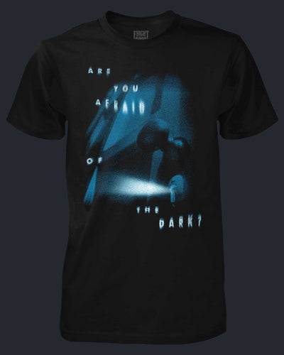 Black t-shirt with a graphic design and text 'Are you afraid of the dark?' on a dark background