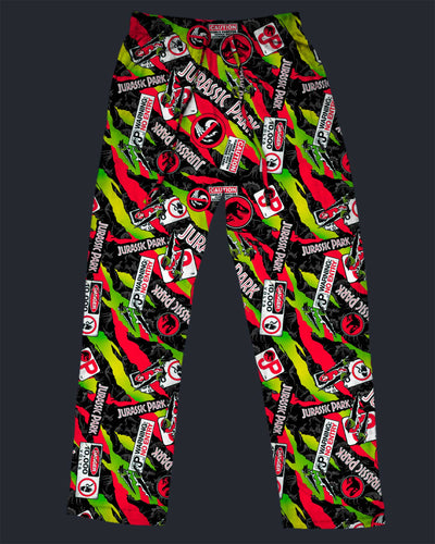Pajama pants with 'Jurassic Park' logo pattern on a dark background