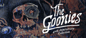 The Goonies 40th Anniversary Collection logo with a skull and treasure chest on a dark background.