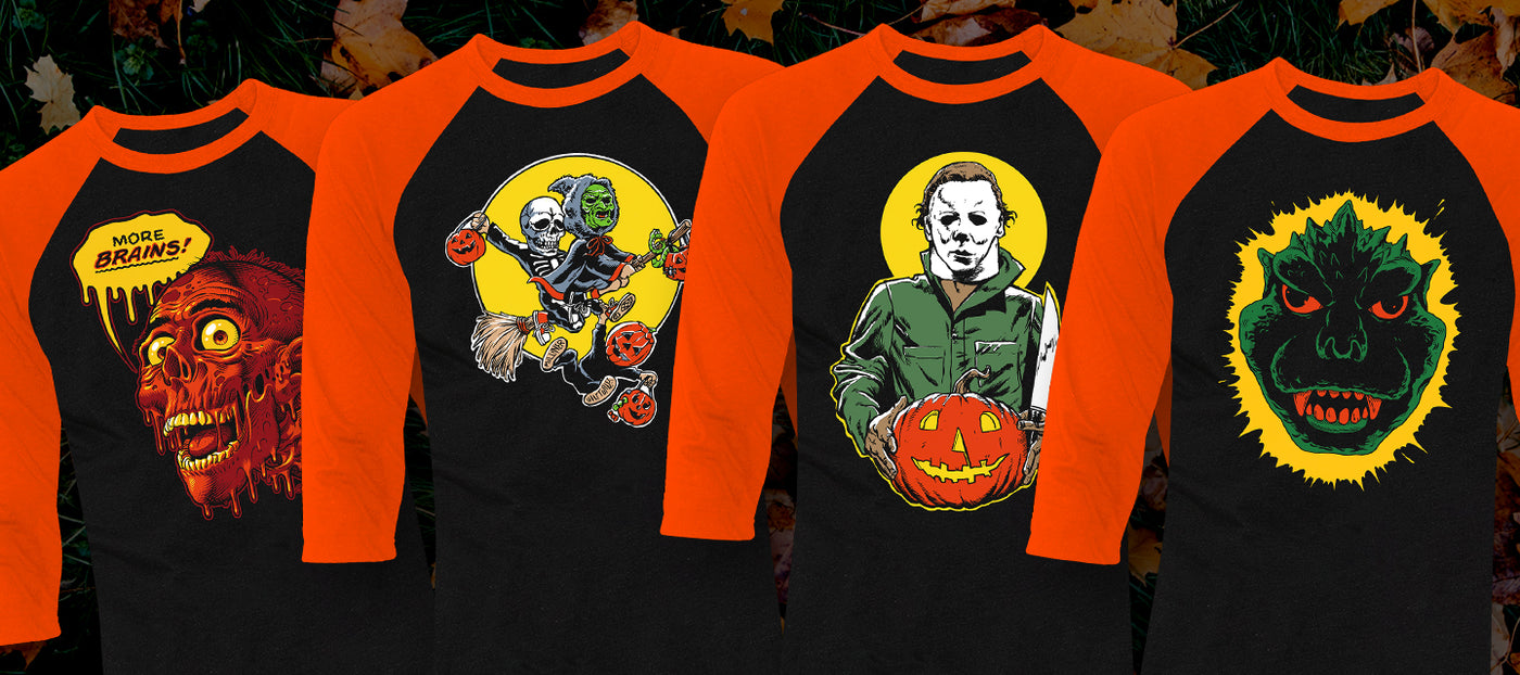 Four Halloween-themed shirts with graphic designs on a black background